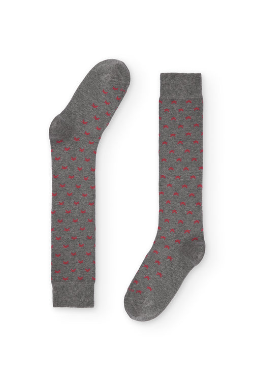 Calcetines de caña alta con estampado de estrellitas, 90 % algodón y logo NAIVE en la puntera; tejidos en España