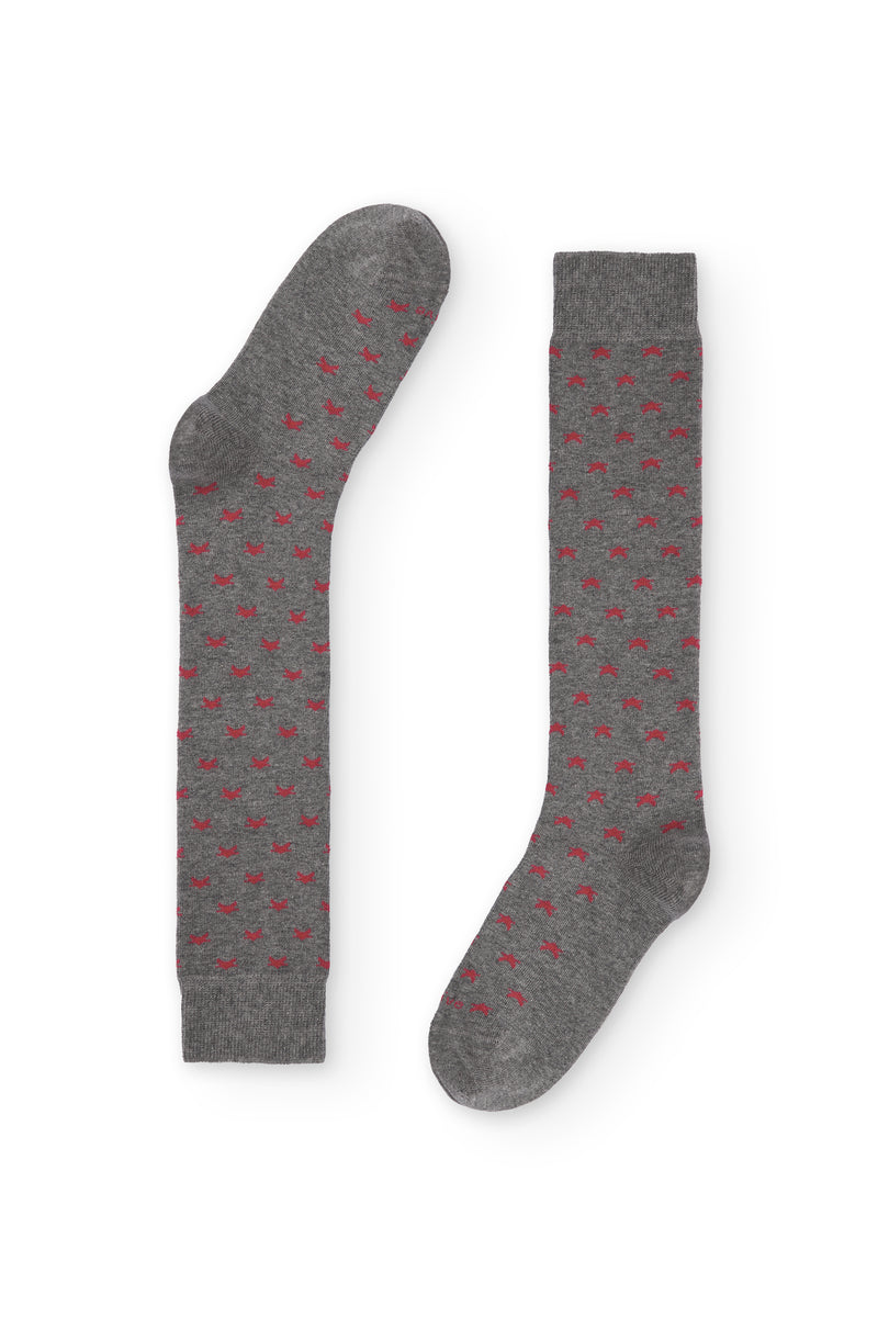 Calcetines de caña alta con estampado de estrellitas, 90 % algodón y logo NAIVE en la puntera; tejidos en España