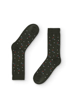 Calcetines verde con estampado de golf, caña media, 90 % algodón y logo en la puntera, tejidos en España.