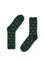 Calcetines verdes con estampado de monos, caña media, 90 % algodón y logo en la puntera, tejidos en España.
