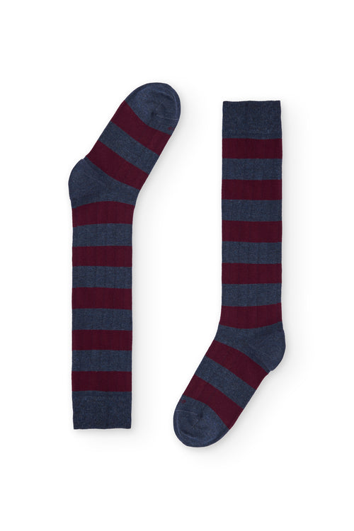 Calcetines de caña alta con rayas anchas azul oscuro y burdeos, estilo rugby, 90 % algodón y logo NAIVE en la puntera; tejidos en España.