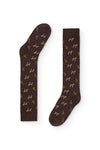 Calcetines azul oscuro de caña alta con estampado safari marrón, 90 % algodón y logo NAIVE en la puntera; elegantes y divertidos, tejidos en España
