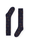 Calcetines azul oscuro con estampado de teckel, caña alta, 90 % algodón y logo NAIVE en la puntera; tejidos en España.