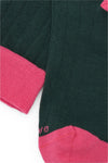 Calcetines knee-high color verde con tejido canalé, mezcla de algodón y lycra, detalle NAIVE en la punta; fabricación española.